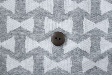 綿（コットン）ジャガードニット　リボン　杢グレー の商品イメージ画像